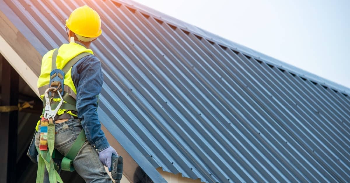Professional contractor working on the roof of a home renovation.