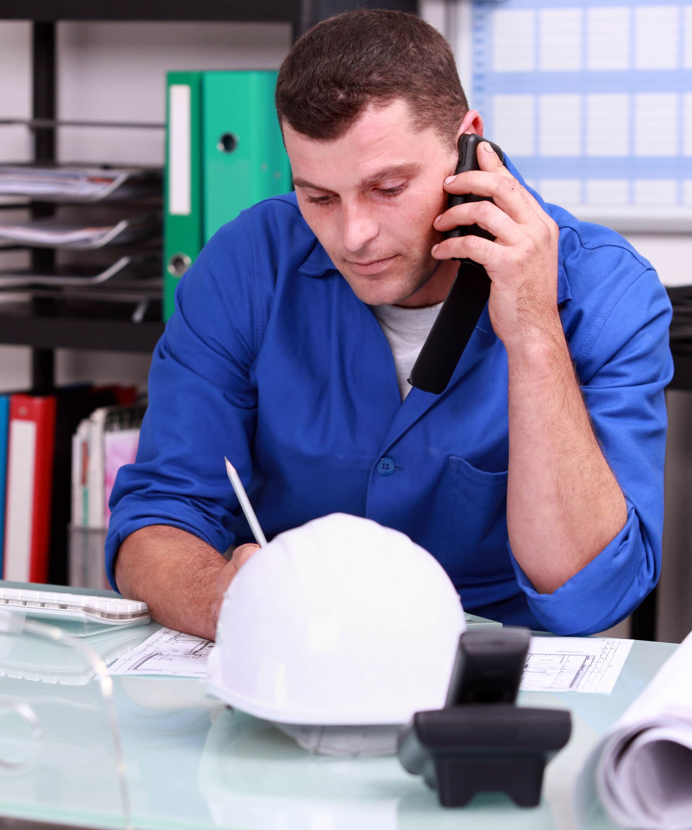 Construction foreman speaking on the phone Man on phone
