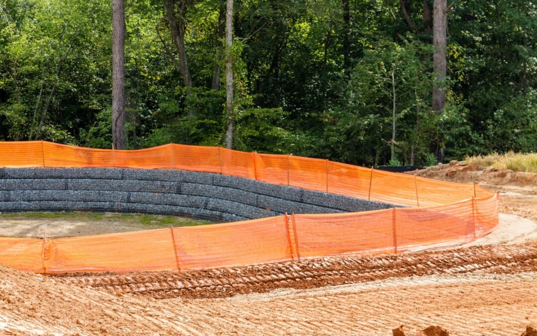 Sediment control cloth surrounding an area on a construction site.