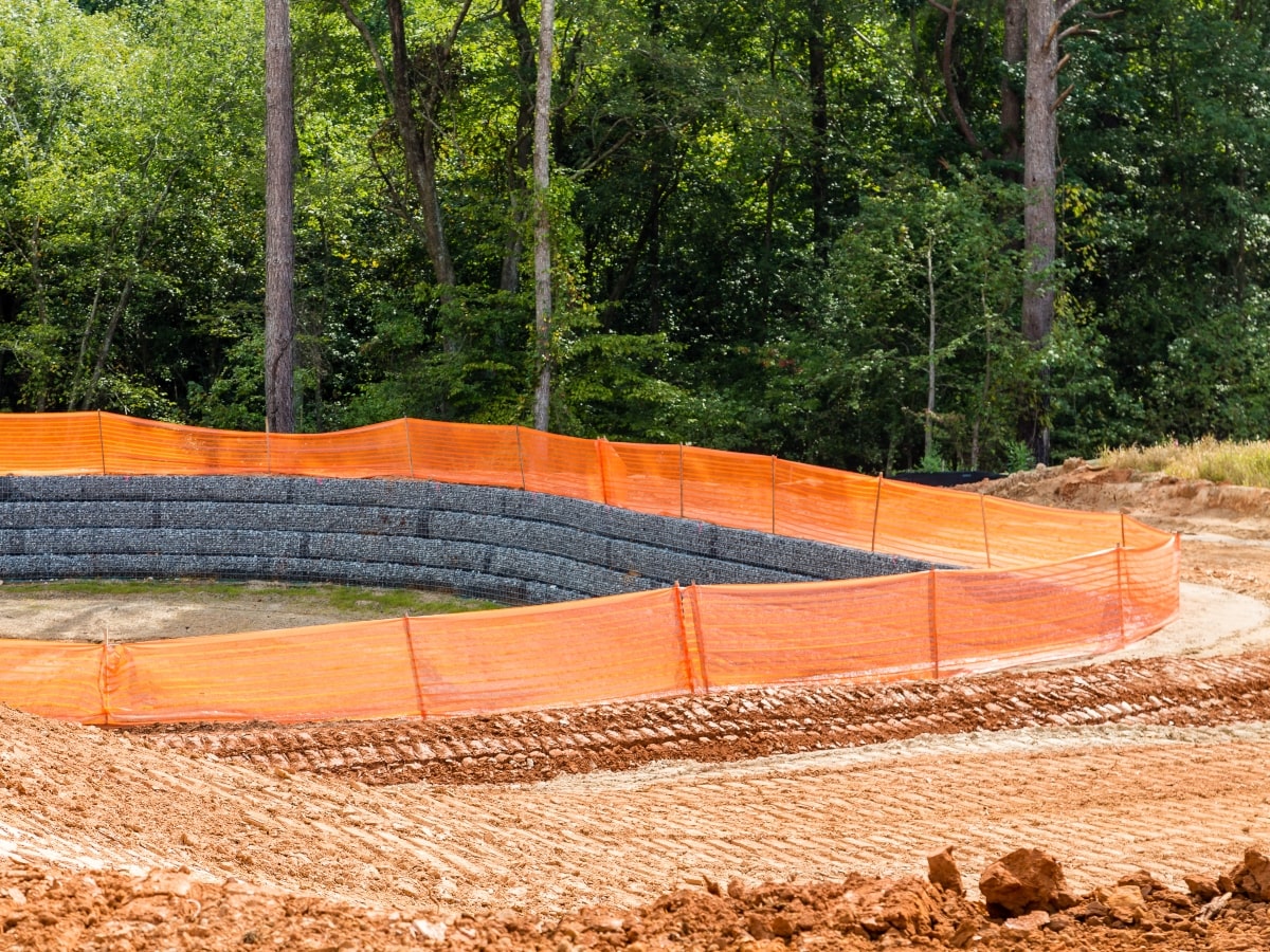 Sediment control cloth surrounding an area on a construction site.