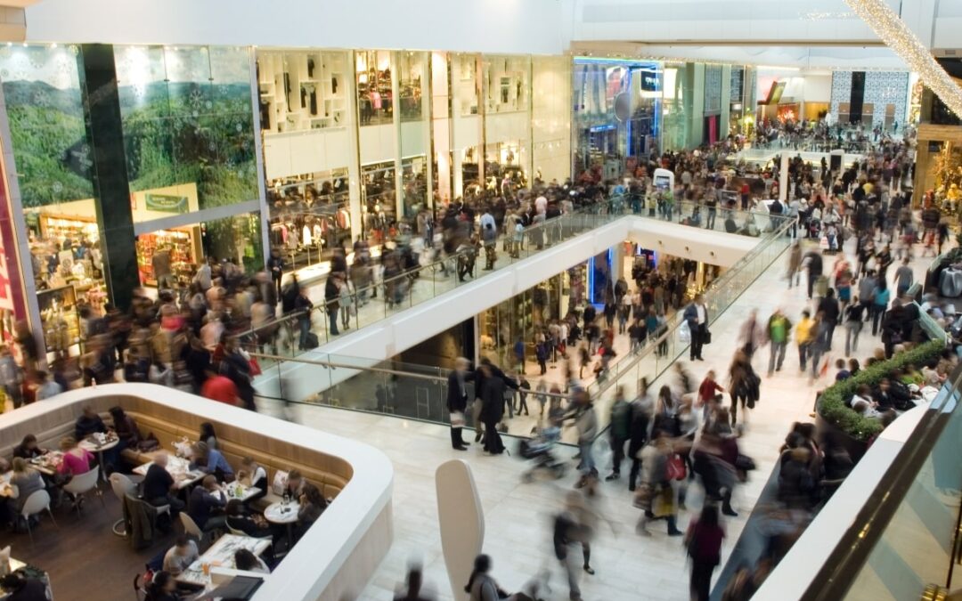 High point of view of busy a shopping centre with crowds of people.