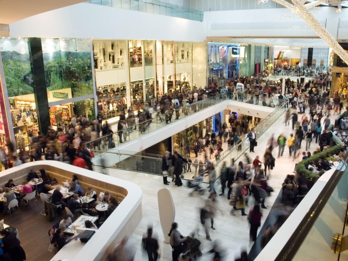High point of view of busy a shopping centre with crowds of people.