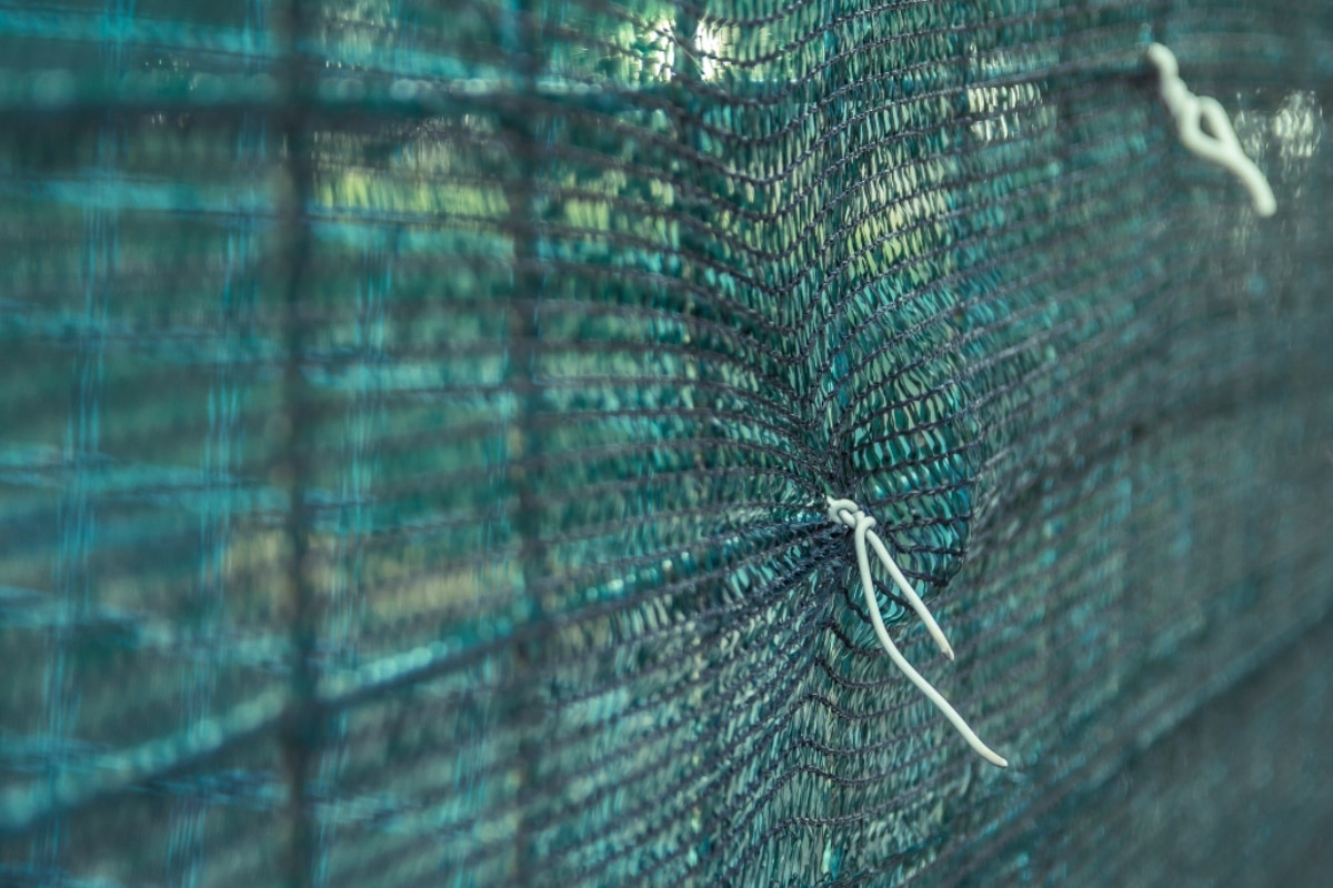 Mesh fencing, netting and shade cloth used for garden fencing.