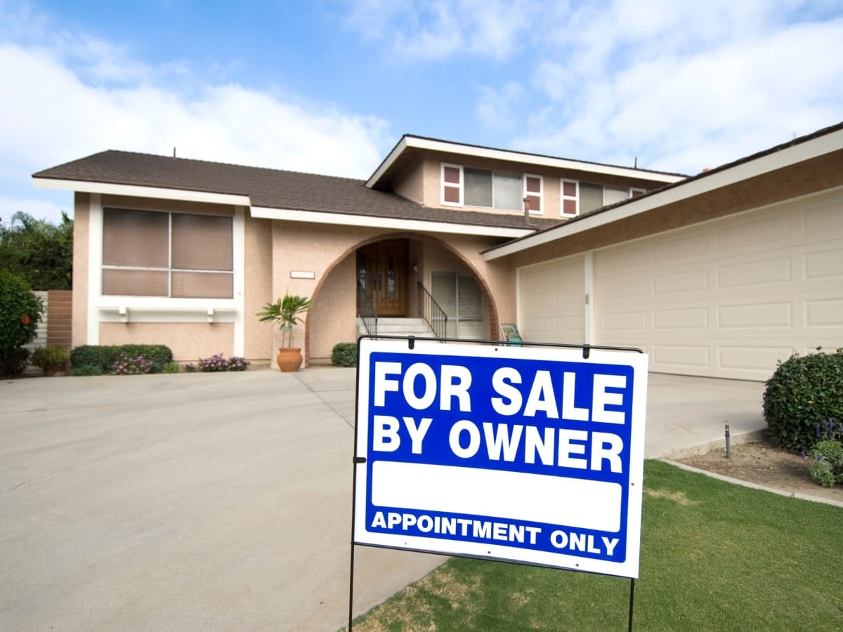 Real estate sign signs used to advertise and sell a house.