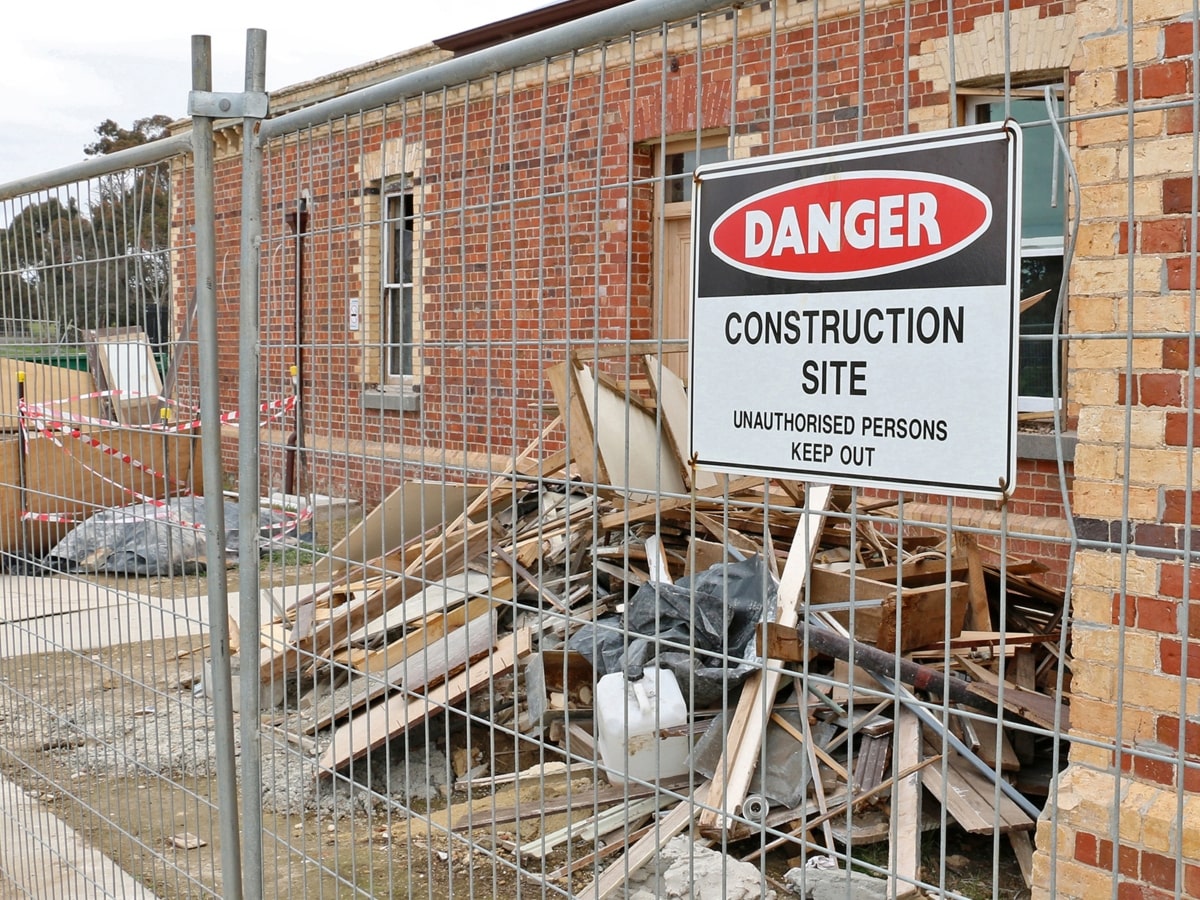 Temporary fencing surrounding construction site.