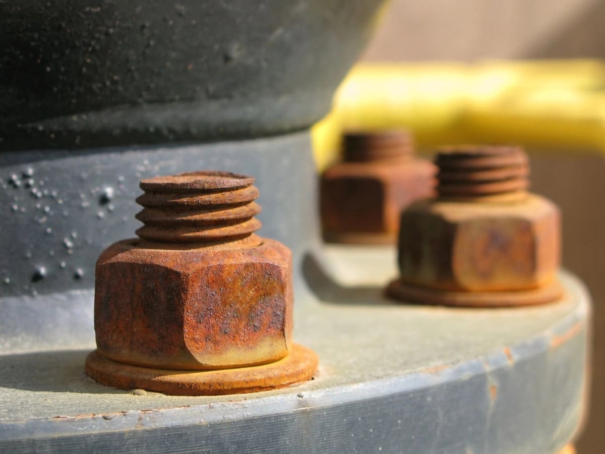 Close up of rusted metal bolts, demonstrating the corrosion resistant benefits of galvanisation.